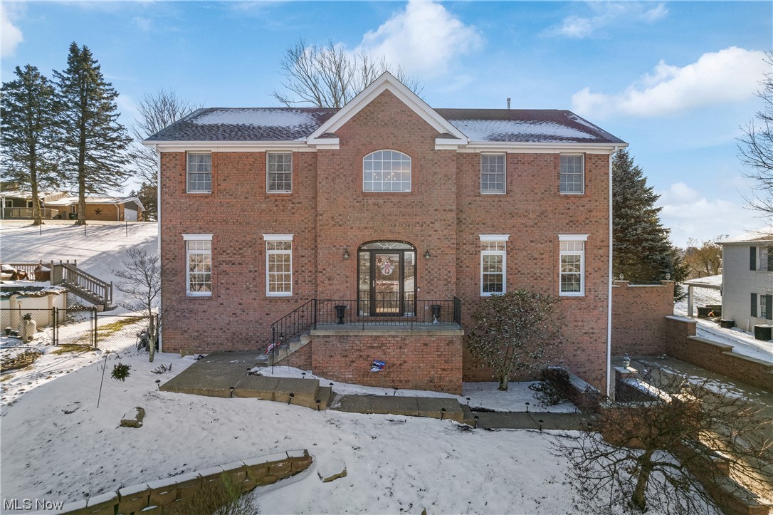 Welcome to 120 Martha Drive! Every inch of this stunning 4-bedroom, 4-bathroom home has been meticulously maintained and thoughtfully updated. This home is located on a dead-end street in a desirable neighborhood and includes a second fenced in lot totaling just over a half acre. Here, you have the comfort of a quiet and welcoming neighborhood while being conveniently located just a short drive to businesses, schools and I-70. Step inside to discover the breath-taking foyer with two-story ceilings and beautifully refinished hardwood floors. To your left you will find a sitting room with unlimited potential of use,  from a study to a play room. To your right, you will find a formal dining room to enjoy family dinners with a view of the most lovely sunsets. The kitchen features ample cabinet space and organization, granite countertops, an island with a breakfast bar and additional seating ideal for entertaining or spending time with loved ones right in the heart of the home. The grand living room feels spacious and airy due to the two-story ceiling and generous natural lighting. You can cozy up to watch a movie near the fireplace or have coffee and conversation on the far end of the room. There is a full bathroom on the main floor for your convenience and to serve your guests. Upstairs, the perfect bedroom layout awaits you. The large master bedroom with cathedral ceiling offers a sizable master bath complete with a shower, soaking tub, and walk-in closet. Across the hall is a full bathroom that serves the two additional bedrooms with large closets. In the finished basement, you will find a den, 4th bedroom, full bathroom, plenty of storage space, your clean laundry area, and access to your 2-car garage. The back patio is like your own private retreat where can enjoy the cool evenings in the hot tub. On those hot summer days, you can enjoy the above ground pool with a newly built deck. Schedule a showing to appreciate the beauty this home has to offer in person!