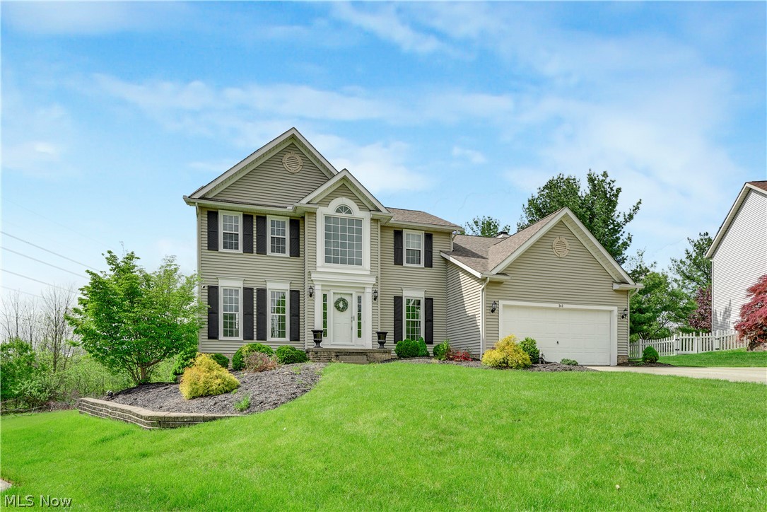 Nestled on a peaceful cul-de-sac in the highly desirable Eaton Estates neighborhood, this impressive Sagamore Hills Colonial blends space, comfort, and modern updates throughout nearly 3,900 square feet of living space. Offering 4 bedrooms and 3.5 baths, this home features an inviting layout designed for both everyday living and entertaining. Upstairs, all four bedrooms provide generous space, including a luxurious owner’s suite complete with a walk-in closet, double vanities, a relaxing soaking tub, and stylish flooring and lighting updates completed in 2023. The main level welcomes you with a bright and airy floor plan featuring formal living and dining areas, along with a warm and inviting family room centered around a gas fireplace. The beautifully remodeled kitchen, updated in 2022, showcases stainless steel appliances, a new dishwasher installed in 2024, and a casual dining area with access to the expansive multi-tiered deck overlooking the private backyard setting. First-floor laundry includes a Maytag washer and dryer added in 2023. The finished WALK-OUT lower level offers a full bath, oversized recreation space, kitchenette with wet bar, microwave, and mini refrigerator, plus abundant storage. Slider access leads directly outside to a serene backyard retreat surrounded by mature trees and a cozy fire pit area! Recent improvements provide peace of mind and include AC 2023, updated lighting throughout most of the home (2023), first-floor flooring replacement (2022), front door (2022), windows (2020), hot water tank (2020), roof (2019), and furnace (2018). The basement also received fresh paint and new carpeting in 2024, deck repainted 2023, landscaping refreshed in May 2025. Eaton Estate amenities including the community pool, clubhouse, tennis,  pickle ball courts, and playground, this move-in ready home offers the perfect combination of privacy, updates, and neighborhood living — all with no RITA taxes!