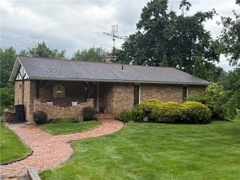 Enjoy peaceful country living in this well-maintained brick ranch on nearly 0.70 acres with beautiful farmland views. Offering over 2,200 square feet of finished living space, this 3-bedroom, 2-full bath home features a spacious eat-in kitchen, large dining area, main-level laundry, and a cozy living room with a wood-burning fireplace. The finished walk-out lower level includes a large family room with a wood-burning stove, two bedrooms, a full bath, and plenty of space for entertaining or a home office. Relax on the deck or patio overlooking the private backyard surrounded by mature trees.