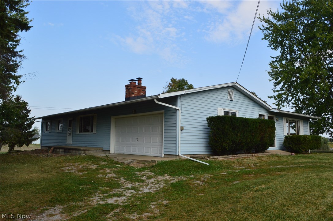 Nice home with MOTHER IN LAW suite. Situated in the country on 3+ acres. This home sits back from road, with a tree lined drive. Features of this home include hardwood floors in some rooms, partial basement, wood burning fireplace, Sunroom, and an attached 2 car garage. The bedrooms, Living room, and eat in kitchen area are nice sized. The Master Bedroom Suite has his and her closets. The Mother In Law Suite could be converted to make the home larger. Heating is shared between the Main Unit and the Mother In Law Suite. There are 2 seperate hot water tanks. Room sizes are approximate. This is a HUD home. Case # 412-769063. Home is sold AS IS.