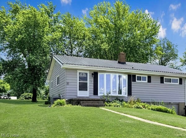 Welcome to this charming three-bedroom, one-bath ranch home in the heart of Wintersville, Ohio. The sleek gray and black modern exterior welcomes you to a thoughtfully maintained property featuring tons of natural light, stunning hard wood floors, newer roof, furnace, and windows. Inside, you’ll find a cozy, well-designed living space with a full basement for extra storage or future expansion. The standout is the massive backyard .32 acre , complete with beautiful mature trees, a large shed, and plenty of room to relax or entertain. With a one-car garage, this home offers both style and functionality in a prime location.