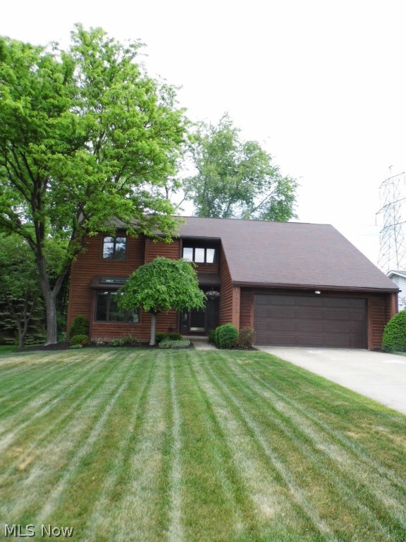 Check out this gorgeous Cedar-sided contemporary in park-like setting!  Beautiful yard & landscaping with huge rear deck looking onto wooded view. Great for cookouts & outdoor entertaining! Dramatic, soaring vaulted space with wood-beamed ceiling in Great Room featuring a floor to ceiling stone fireplace, TWO sets of sliding glass doors to awesome, deck beautiful views. Adjoining dining room has vaulted ceilings, is convenient to the eat-in kitchen, which features oak cabinets, newer countertops, sink with disposal as well as a garden window. A nicely appointed 1/2 bath is right off the foyer entry for great layout. The foyer, kitchen, and 1/2 bath all feature hardwood floors. First floor Master Suite with a bonus room currently used as a nursery; could be a cozy home office or #2 Walk In closet! The very large master suite also features a dual bathroom with separate sink area and shower/toilet room and a huge walk-in closet with storage organization system. Upstairs are two LARGE bedr
