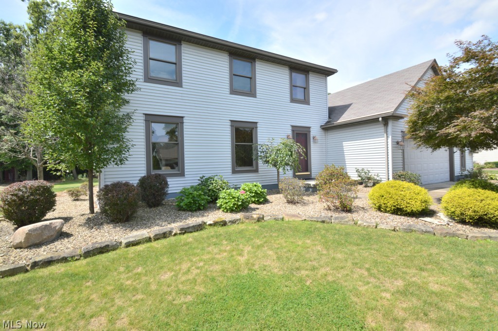Meticulously maintained 2200+ square foot home in Poland.  The first level of this home plays host to a spacious kitchen with ceramic tile and stainless steel appliances, a family room with cathedral ceilings, skylights, and brick fireplace, formal dining room and living room with crown molding, a large laundry room, and half bath.  Three large bedrooms and two full baths, which include a master suite, comprise the second level.  A full waterproofed basement with finished rec room provides additional living space as well as ample storage.  Exterior features include a new front porch, gorgeous rear patio, a 2+ car garage with nature stone flooring, and a three car wide concrete driveway all nestled on a 1/2 acre lot.  This home has a security system and is protected with a 12 month home service warranty plan.  Call today!!