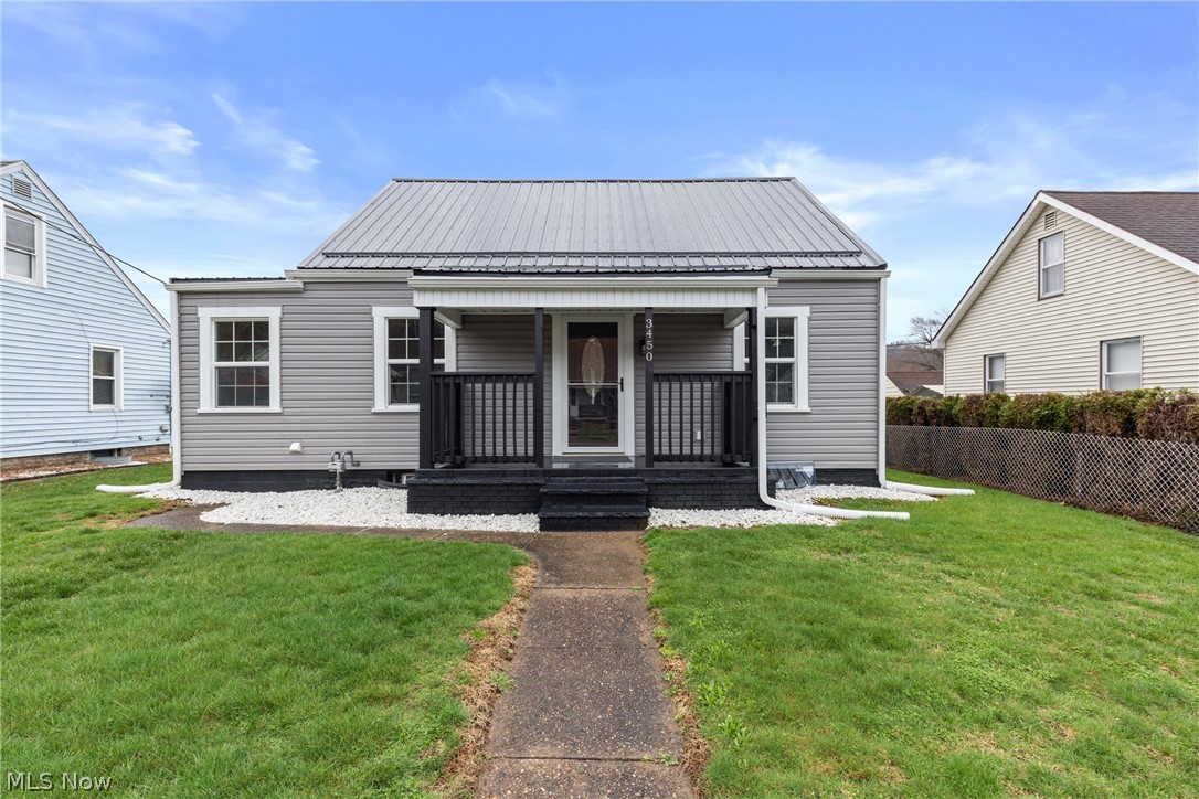 Welcome to 3450 Elk Ave in Shadyside, Ohio—where there's nothing to do but move in! This is a beautifully remodeled 3-bedroom home that blends modern convenience with fresh, stylish charm. The kitchen has endless updates to make cooking up meals a dream. Here, you'll find new tile flooring, cabinetry, solid surface countertops, and a charming backsplash, all to compliment your brand-new appliances. Continuing on the main floor, you'll also find up to 2 bedrooms and an addition featuring a main floor laundry room which is conveniently located right next to the sparkling new full bath, equipped with all new vanity, toilet and beautifully tiled tub. The upstairs has been freshened up into a third bedroom with a cozy loft space—perfect for work, play, or relaxation. The lower level offers even more to love with a partially finished rec room, bonus room, a second bathroom for added convenience, and storage space. There have also been many mechanical updates including a new furnace, A/C, water tank, updated wiring, outside electrical service, and PEX plumbing. Outside, you’ll love the curb appeal and peace of mind with new siding and insulation board, roof, gutters, window trim, exterior paint, gas line, plus a gorgeous 30x10 newly built wooden deck—ideal for that morning coffee or quiet evenings. Say goodbye to street parking because you now have a garage with a new matching roof and paint, new garage door, and garage door opener! This home has truly been transformed—modern, clean, and ready for you to call home!