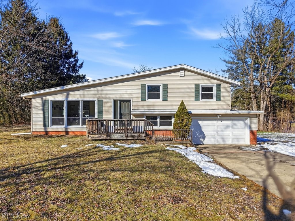 Beautifully updated split-level offering peaceful country living just 9 minutes from Summit Mall, 7 minutes to I-77, and minutes from everything Montrose and Fairlawn have to offer. Set on a wooded lot of over an acre in the award-winning Revere School District, this home blends privacy, space, and convenience effortlessly.

Inside, you’ll find four thoughtfully designed levels, each meticulously updated. The main living area features a bright eat-in kitchen with new appliances, an large den/family room with deck access and brick fireplace, and a light-filled living room showcasing refinished hardwood floors that continue throughout the home. Fresh paint and modernized light fixtures add a clean, cohesive feel from top to bottom. 

Upstairs, three bedrooms share beautifully refinished hardwood floors and a completely remodeled full bath. Just steps down from the main level, a mudroom leading to the attached garage, a cheerful office space, and refreshed half bath offer flexibility for work or guests. Office could also be used as a fourth bedroom, rec room, or bonus space. One level below the garage level access, a spacious rec room in the partially finished basement provides additional room to spread out. The two lower levels have the potential to be used in various ways. 

Enjoy the serenity of your deep wooded lot from both the front and rear decks — perfect for morning coffee or evening unwinding. A large outbuilding adds valuable storage and convenience. Additional updates include new kitchen appliances and a newly installed sump pump, Hot Water tank 2024, water softener 2025, new roof over garage 2025.

Polished, move-in ready, and surrounded by Summit County’s parks, recreation, and shopping — this is the privacy you want with the proximity you need.