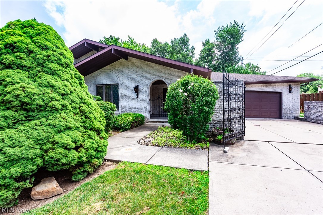 Welcome home to this charming brick ranch in the heart of Independence! This well-maintained home offers 3 bedrooms and 2.5 baths with a spacious and functional layout designed for comfortable everyday living. The kitchen features a center island with a cooktop, making meal preparation and entertaining easy. Gather with family and friends in the cozy great room, complete with a huge wood-burning fireplace, or enjoy meals in the formal dining room. The great room opens to a large sunroom equipped with a gas heater, allowing you to enjoy the space comfortably throughout the year. The full unfinished basement provides endless possibilities, featuring a wood-burning stove for added warmth and the potential to create additional living space while still offering abundant storage. A convenient first-floor laundry room includes electric hookups for your washer and dryer. Additional highlights include a whole-house fan and a newer central air conditioning unit. Relax on the back patio and take in the beautiful shaded setting, perfect for morning coffee or evening gatherings. Don't miss the opportunity to make this inviting ranch your next home!