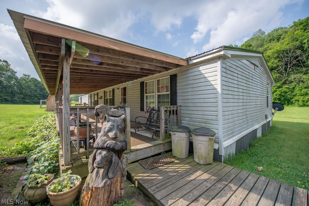 Escape to the country with this exceptional 20-acre property!   This expansive property offers the perfect blend of peaceful, private living with incredible functionality. The spacious 2,052 sq. ft. triple wide mobile home features a flexible 4-to-5 bedroom layout with 3 full baths, completely move-in ready with all appliances conveying and a brand-new metal roof installed in 2025. The land is a dream come true—mostly clear and flat transitioning into serene, wooded acreage in the rear.   Outdoor storage and workspace abound with a massive 40 x 80 pole building, plus two additional sheds * 9 x 12 and 8 x 10 and a carport for all your equipment, toys, and vehicles.  Schedule your private showing today to experience this peaceful retreat!