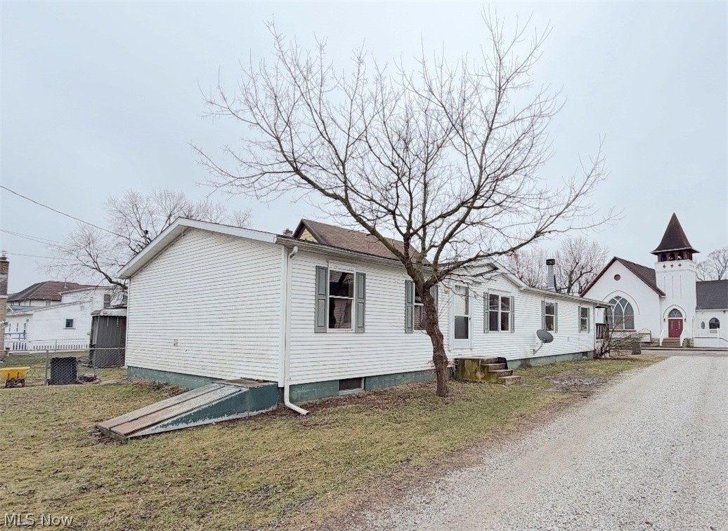 Bring your vision and make this spacious one-story home your own. This 3 bedroom, 2 1/2 bath fixer-upper offers a great layout and plenty of potential for the right buyer looking to add their personal touch. This manufactured home is on a full basement and taxed as real estate. There is a large kitchen with a center island. The family room has a gas fireplace. The master suite has his and her closets and a private bath with a double vanity, a soaking tub, and a separate shower. There is a convenient first floor laundry that adds everyday functionality. The lower level has a room that could easily be a 4th bedroom, a commode, and lots of room for storage or the possibility of finishing. Outside there is a nice, covered deck and a cement pad that is great for parking or recreation. Cash or conventional loan offers only.