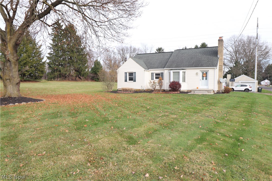 Welcome to 900 Woodlawn Ave NW!  This home is a true gem! Convenient location! Perry schools! 4 car "mechanic lovers" garage! Sits on over half an acre, corner lot! Home is well maintained, immaculate, and move-in ready! Features include:  Inviting breezeway with newer tile flooring. Updated, fully applianced eat-in kitchen with gorgeous laminate flooring. Spacious yet cozy living room offers built-ins, wood-burning fireplace with blower and a charming window seat for relaxing! 2 nice sized bedrooms on the first floor and two bedrooms on second floor with plenty of storage and closet space. The first floor family room offers additional living space or would make an awesome in home office. Large 3 car attached garage with half bath, and single detached garage with extra storage! Nice, newer oversized concrete driveway allows for ample parking and guests.  This home is a must see!  Call for your showing today!