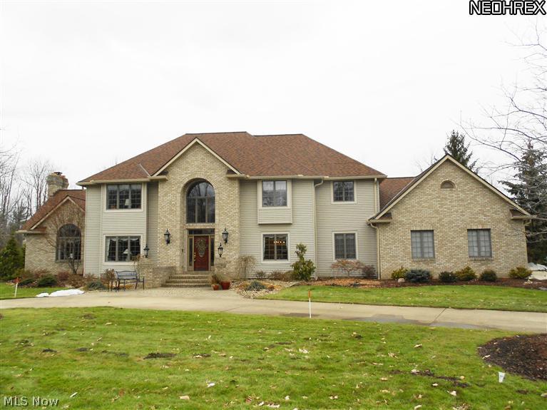 Elegance at its best!  Circular drive & front stone patio welcome you to this exquisite 5 bedroom, 4 full & 2 half bath custom built home in Canterbury On The Lakes.  Expansive gourmet eat-in kitchen features hdwd floors, granite counters, breakfast bar & SS appliances.  French doors open to striking 1st floor office.  Large dining room w/trayed ceiling, formal living room, vaulted family room w/built-ins, gas FP & wet bar.  Convenient 1st floor laundry, spa-like master suite offers gorgeous vaulted bath w/newer heated tile floors, heated jacuzzi tub, glass block shower, double walk-in closets & skylights (2012-13).  Two staircases make easy access to 2nd floor from front or back of house.  Finished lower level offers rec room, media room & half bath.  1st floor full bath w/changing room opens to the private & tranquil backyard.  Beautiful in-ground pool, Timber Tech deck, stone patio & gazebo create the perfect space for entertaining. Four car garage, home warranty w/pool coverage.