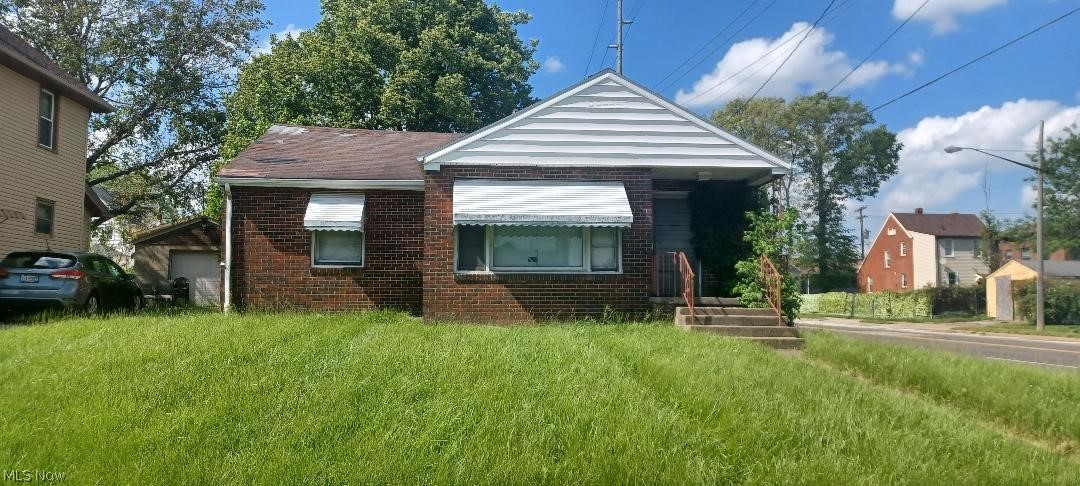 Nice Brick Home on corner lot. Wood floors in Living Room, Dining Room and bedrooms. Fireplace and bar in basement.  Priced to sell!  Great for homeowners and investors.