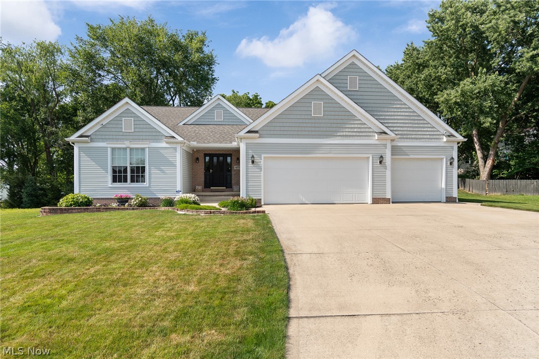 Impeccably maintained by its original owner, this move-in-ready ranch melds quality, comfort, and future possibilities! Tucked away on a quiet cul-de-sac in The Vineyards at Old Mill, this exceptionally clean, one-owner home showcases an open floor plan with soaring vaulted ceilings, abundant natural light, and tasteful updates throughout. The spacious great room features a cozy gas fireplace and flows seamlessly into the beautifully appointed kitchen with granite countertops, stainless steel appliances, a large center island, and plenty of workspace. The vaulted dining area opens through sliding doors to a covered patio with a ceiling fan, overlooking the private backyard and paver patio…the perfect spot for evenings around a fire pit. Newer LVP flooring enhances the main living areas, while the convenient first-floor laundry includes a utility sink. Car enthusiasts and hobbyists will appreciate the heated three-car garage, and the full basement with 9-foot ceilings offers incredible potential to nearly double the home's living space. Additional features include a whole-house Kinetico water softener, reverse osmosis system to the kitchen refrigerator/ice maker, a wired security system, and exterior cameras that will remain. An extraordinary bonus: the adjacent .40-acre buildable homesite is available for purchase separately, giving you the rare opportunity to choose your own neighbor, expand your yard, or invest in additional property next door. This is a truly special offering that doesn't come along often!