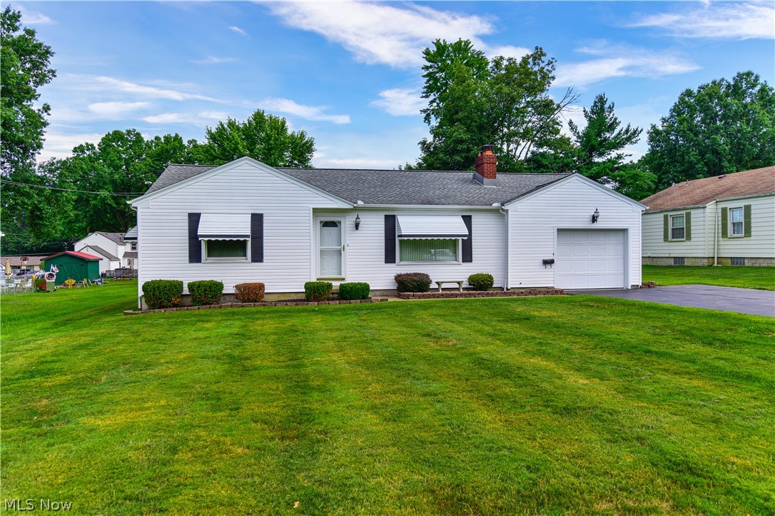 This well maintained ranch is move in ready! The large living room with wood burning fireplace and formal dining room are perfect for entertaining. The eat in kitchen provides abundant space and includes newer appliances. Off of the kitchen is a spacious laundy/ utility room with outdoor access. Two large bedrooms with hardwood flooring under carpet and one full Bathroom with tub/shower. Large backyard with tons of potential for children, pets or outdoor entertaining. One car garage with widened driveway pull off for additional parking. Newer roof, siding, garage door opener. Located next to the park and conveniently near plenty of shopping, restaurants, and highway access.