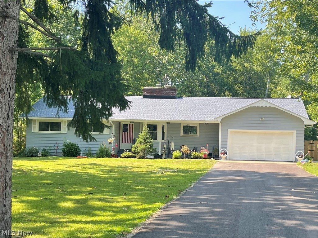 Welcome to the .78 acre wooded lot on a quiet culled sac with mature trees. The home boasts three wood burning fireplaces, a bonus room, fenced in backyard, 2-car garage, storage across the entire top of the house, and updates throughout the home! The home had a New asphalt driveway added in May 2026, a brand New fence, roof, gutters, fireplace flashing in October 2025, New kitchen and bathroom flooring, 2021 New Windows throughout and New glass block windows in the basement. Since 2021, the following have also been added: New appliances throughout, New bathroom vanity and sinks, refinished tile in the bath and shower, New lighting and ceiling fans, New cement floor in the garage, walkway and steps out to the new patio. Carpeting was added to the bedrooms in 2021, with hardwood floors underneath. Many other updates have also been completed, including a fresh coat of paint.The house has a full unfinished basement with the third fireplace, with the other two on the main floor. Come make this home your own!