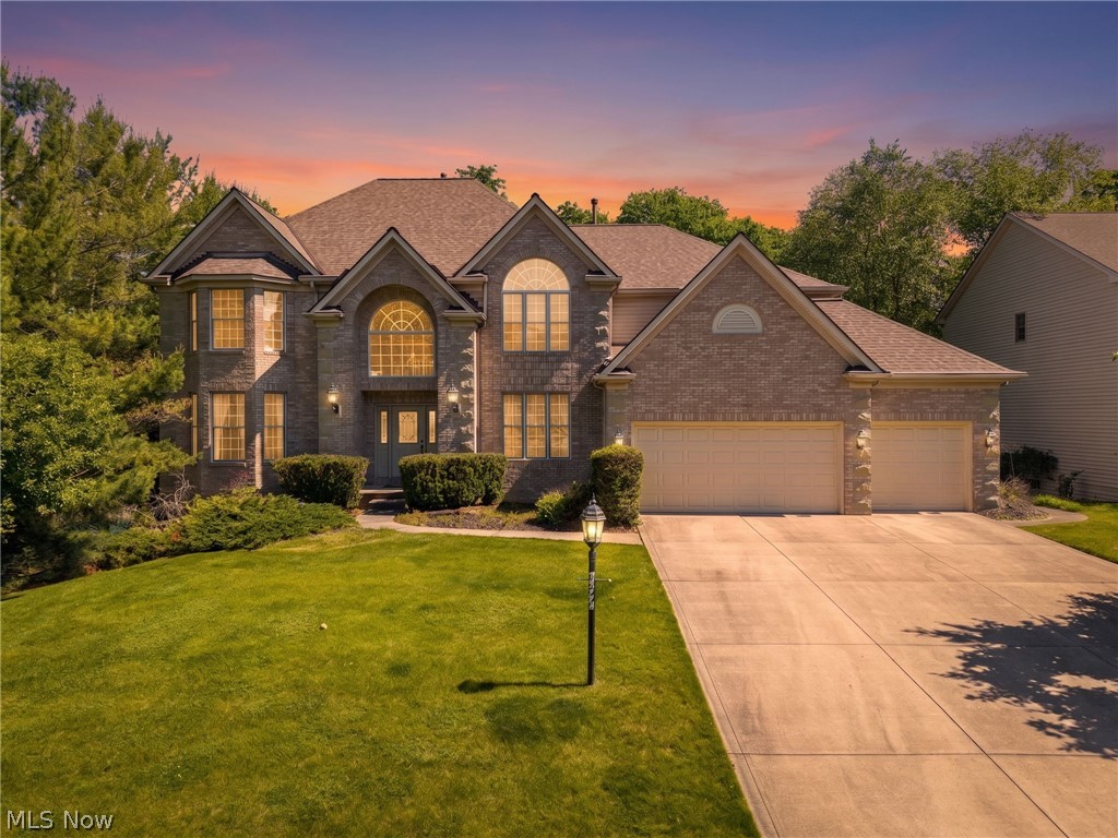 Welcome to 20852 Kylemore Drive in Strongsville's prestigious Waterford Crossings! This exceptional 4-bedroom, 4.5-bath colonial offers 4,548 SF of beautifully designed living space plus over 1,000 SF of living space in the walk-out basement. Beautiful two-story foyer chandelier serves as one of the home’s primary focal points, balancing grand architecture while providing ambient light for both the entryway and the second-story landing. This home is the perfect blend of elegance, comfort, and functionality. The heart of the home is a breathtaking gourmet kitchen featuring granite countertops, custom glass front cabinetry, large island, and top-of-the-line stainless steel appliances — including a coveted Sub-Zero refrigerator. The dramatic two-story family room commands attention with a soaring floor-to-ceiling fireplace mantle, multiple windows creating a warm, airy and inviting atmosphere perfect for both everyday living and entertaining. Large office or bonus room off the family room with natural hardwood floors. An elegant two staircases adds a grand architectural touch along with custom hand painted columns, while serene pond views from the composite deck bring a sense of tranquility to the home's natural surroundings. All four bedrooms are upstairs along with three full bathrooms. Primary suite is massive with tray ceilings, large bathroom and walk-in closet. Jack and Jill bathroom perfect for families or guests. Another bedroom has its ensuite great for convenience and privacy. The partially finished walk-out basement — complete with a full bathroom — offers flexible space for a recreation room, home gym, or future expansion. Tons of storage space in the unfinished portion. Complete the picture with a spacious 3-car garage — don't miss your chance to make this one yours.