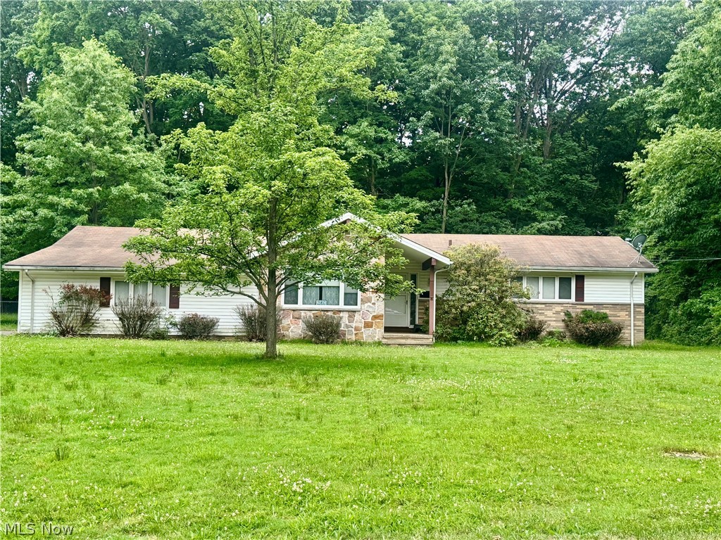 Welcome Home to this beautiful Ranch, located in Richmond Heights, featuring 3 bedrooms, 2 full baths and 1,892 square feet of living space. This home offers the perfect blend of peaceful scenic views and everyday convenience with functional one floor living, nestled on 0.70 picturesque acres and tucked away on a quiet cul-de-sac. 

Upon entering you’re welcomed to a beautiful ceramic tiled foyer. To the left, one step down, is a cozy family room perfect for just relaxing, movie nights, hobbies, and/or additional entertaining space. The spacious living room and dining room has sliding doors to the peaceful backyard with wooded views. Conveniently located off the dine-in Kitchen which includes a dishwasher and ample cabinet and counter space is a bonus room which could be a craft, exercise or office room or make it what you like. Rounding out the main level are three bedrooms with the Master bedroom featuring an en-suite full bath. The lower level of equal size expands your living space and provides exceptional flexibility with 3 separate areas for storage, separate laundry area and workshop space if desired.

Additional highlights include an attached 2-car garage, central air and in-ground sprinkler system. An ideal location close to parks, shopping and dining. All the amenities Richmond Heights has to offer, this home combines comfortable convenience, functionality, and a great location!! This home will check many of your boxes and is perfect for many types of buyers.