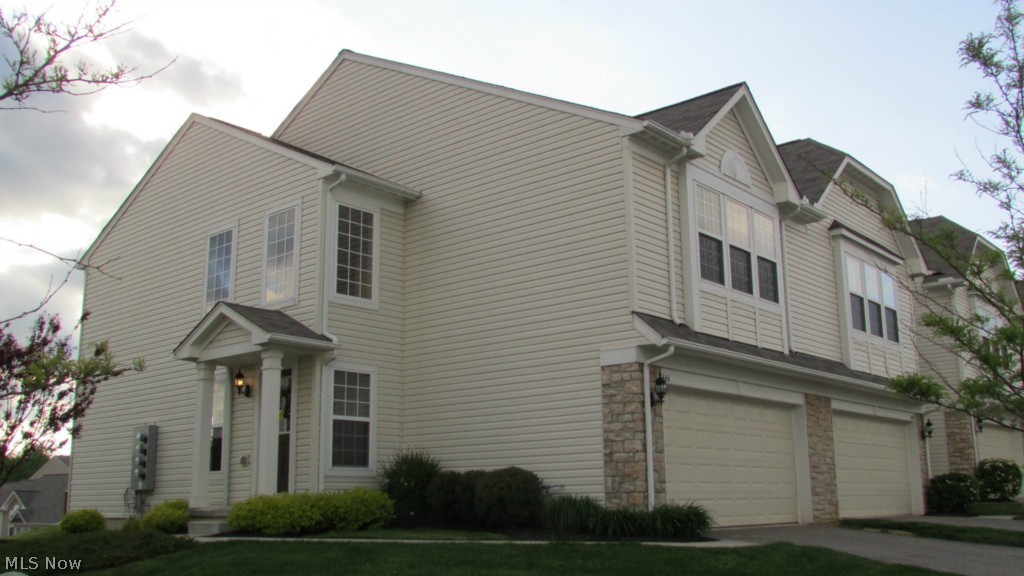 This spectacular home is 4 years young! Many upgrades to this trendy end unit town home!  Brand new carpet 2014, 9ft ceilings, glamour kitchen with granite countertops, stainless appliances, hardwood floors, dining area overlooking pond. Lovely spacious 2 story foyer, very large master bedroom suite with walk in closet, 2nd floor laundry, and spacious loft. Neutral decor, neat and clean, ready to move in. You will be impressed with the little things in this home such as upgraded fixtures, lighting, hardware and doorknobs, etc. You will find the location convenient to shopping and restaurants, parks, as well as friendly neighborhood.