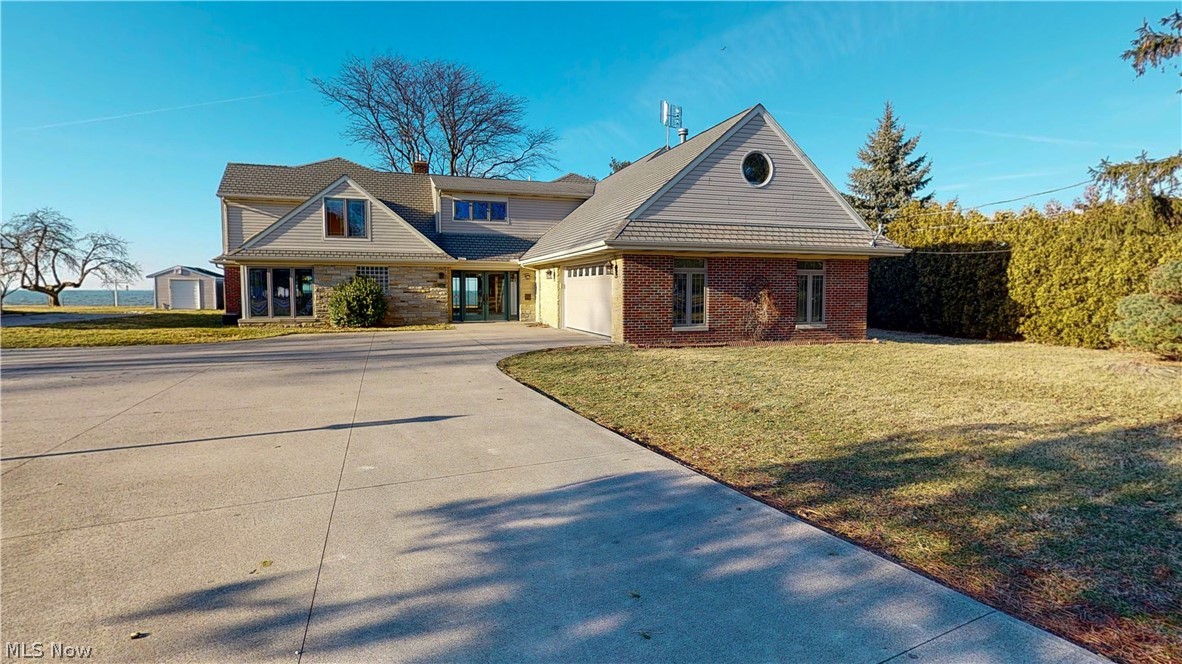 1.7 acres on the water and 4945 square feet of lakefront views from almost every room. No expense was sparred in this custom build on Lake Erie with lake access. over 700,000 of new construction completed 2002, Up-Level Solid Construction, over 30 tons of structural steel used, all exterior walls sheathed in 3/4 plywood, added sound insulation on interior walls, Extensive supplementary climate control systems, four zoned forced air systems, 5 zones tile heating, 2 zone ceiling radiant heat system in north facing rooms, snow melter coils in driveway near garage, new sewer line and storm drains added, all tile is low skid high traction tile, all doorways are wheel chair width, plumbed behind wall for downstairs utility room(currently upstairs),entire house wired for catV, east end of breakwall was enlarged at base and filed with concrete 2001, reventment of large block placed adjacent to wall in 2000 to prevent scouring, gravity seawall retains its original construction of filler-high we