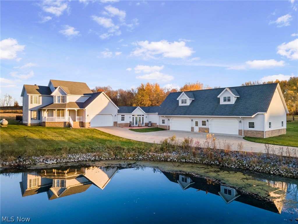 This home has been carefully crafted for YOU! The combination of Premium Materials and Impeccable Workmanship you'll find here is UNMATCHED.
The First Floor of the Main Home is comprised of an Eat-in Kitchen, Living Room, Office/Bedroom, and Full Bath. White KraftMaid Cabinetry & Quartz Countertops keep the Kitchen Bright and Classy, and the Quartz Waterfall serves as your Dining Area. For Poolside Drinks in those Summer Months, or something to warm you up through Winter, A Conveniently located Wet Bar rounds out the highlights of Your Brand New Kitchen! Upstairs you will find the Swank Master Suite, Laundry Room/Full Bathroom, & Third Bedroom. The Master Bathroom reveals a Shower for Two which has been laid out Elegantly with Stationary Glass, Custom Tile, and Dual Shower Heads.
Traverse the breezeway to the Additional Living Suite, located above the Attached Auxiliary Garage. This 1200 Sqft Suite was completed in 2021, The full demo and rebuild includes Hardwood Soft-Close Cabinetry, Dazzling Granite Countertops, and Black Stainless Steel Appliances. More Stunning tile work in the Bathroom, which doubles as the Laundry Room. Adjacent Living Room & Bedroom lead to the Massive Walk-In Closet to round out this Beautiful Suite.
In-Ground pool with Diving Board! Fenced-In-Yard! Private Pond! Attached 2-Car Garage + Heated 14-Car garage w/ 12' ceilings!