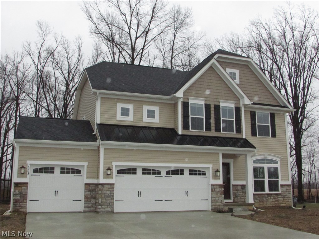A spacious 4 bedroom, 3.5 bath colonial ( less than one year old ) with an open floor plan in the desirable Sandy Ridge Subdivision.  This home sits on nearly an acre, and is adjacent to a 400 acre nature preserve, to which the neighborhood attaches with a walkway just a few feet away.  The open kitchen features granite counter tops, a huge island, upgraded flooring, upgraded maple cabinets, stainless steel appliances, pantry, and a sunroom.  An amazing fireplace highlights the family room that is completely open to the kitchen and sun room, sharing the natural hickory wood floors that run throughout the first floor.  A formal living room/office is also on the first floor.  This home has a finished basement with an additional 600+ square feet of living space, a full bath, and ample storage.  A 20x15 master bedroom opens to a gorgeous bathroom with double sinks, glamour bath, and an amazing glass shower.  Each of the bedrooms is large, and there is a second floor laundry.  A 3 car garag