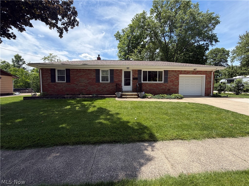 Welcome to this beautifully maintained and improved 3 bedrooms 2.1 bath ranch on a quiet street in the neighborhood of Mogadore Heights.  You'll love the gorgeous kitchen remodel  with lovely maple cabinetry.  The spacious living room offers updated windows, warm carpet and an abundance of natural light.  Bathrooms have been update.  The first floor also features a master bedrooms with ceiling fan and attached half bath.   The second bedroom features a ceiling fan, carpet and updated windows and third bedroom is being used as a play room.  The recreation room offers 450 square feet of addit8ional living space with a desk, built-Ins, bookcases and The utility room offers storage.  a desk, washer, dryer, full bath, built-in and more.  Glass block windows help with security and light.  The oversized garage has built-ins and  new door opener and glass block windows.  The service door to the 3 season room features a ceiling fan, full windows for natural light that oversee the parklike backyard. This home is move in ready and truly sho9ws pride of ownership.  Call today to schedule your showing,