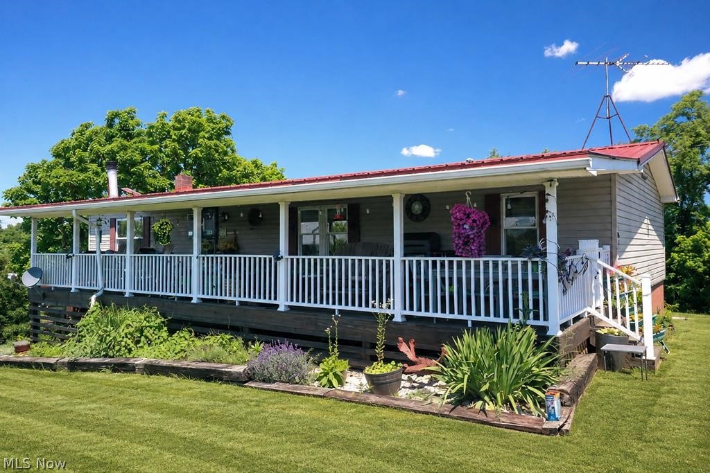 Enjoy privacy and country living on approximately 32 acres, minutes from town! This ranch home features an updated kitchen, wood-burning fireplace, spacious primary suite with double closets and bath with walk-in shower, plus a covered front porch. The finished walk-out basement offers an additional bedroom, walk-in closet, family room, full bath, bonus room, and wood-burner for supplemental heat. Outside, you'll find a pond with a shady picnic area, greenhouse, oversized garage (26x60) with workshop and attached lein-to, ATV trails, barn with stalls, solar power and water, and a gravel pad with utility hookups for an RV. Ideal for gardening, farming, hunting, recreation, or peaceful living.