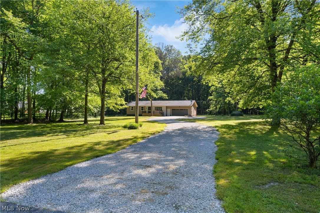 Welcome to 1075 NE River Rd. in Lake Milton, Ohio—a stunning, fully renovated three-bedroom, two-bathroom home that perfectly blends modern luxury with a premier location. Situated right across the street from Lake Milton, this property offers effortless access to everything the vibrant community has to offer, including local golf courses, fantastic restaurants, the winery, shopping, and nearby highways for an easy commute. The home rests on an expansive 2.41 acres of land, giving you plenty of privacy and outdoor space to enjoy.
Every detail of this residence has been meticulously updated to make it truly move-in ready. The exterior boasts two brand-new decks on both the front and back of the home, ideal for relaxing or entertaining. All interior and exterior doors have been replaced, and the home features brand-new windows throughout that come complete with a lifetime warranty, while the basement windows have been upgraded with secure, modern glass block. On the main levels, you will find completely updated bathrooms, all-new flooring, sleek new soft close cabinets, beautiful granite countertops, upgraded lighting, and brand-new appliances.
Beyond the cosmetic beauty, the home's mechanical systems have received a massive upgrade. A brand-new gas line was run to the property, allowing for the installation of a high-efficiency forced-air gas furnace, completely new ductwork, and a new condensing unit to provide central air conditioning and a much more economical heating source. Combined with the fully renovated basement that offers incredible additional living space, this beautiful property delivers the perfect, worry-free lakeside lifestyle you've been searching for.