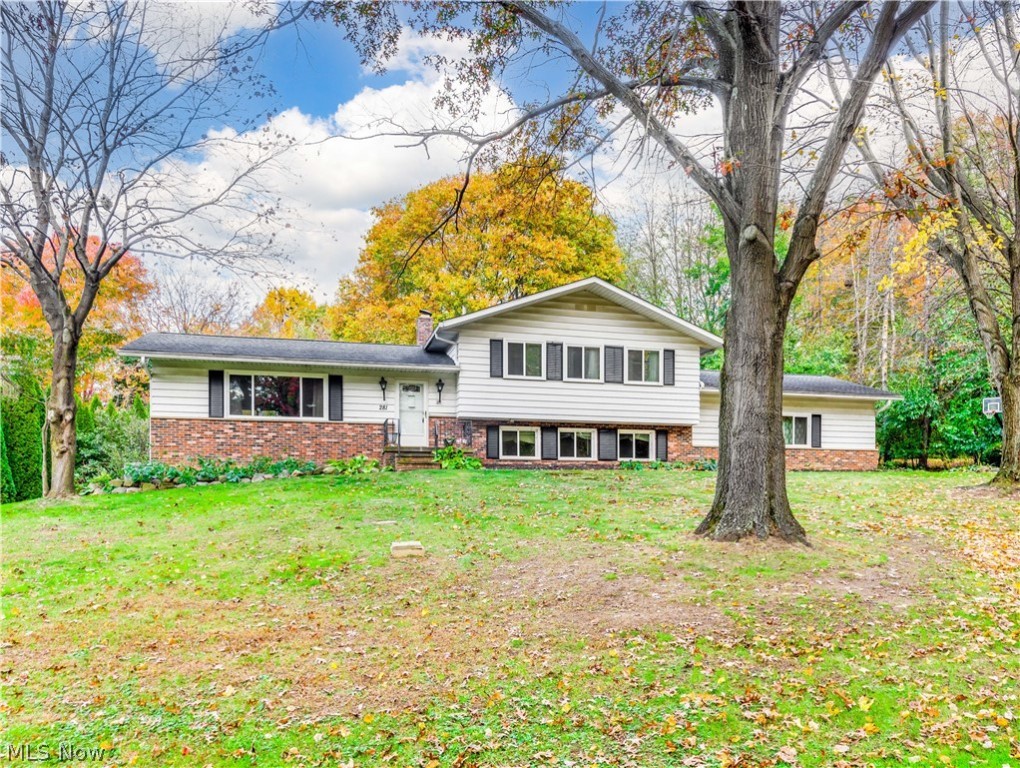 Charming Split Level with 4 bedrooms and 3 full baths in a popular neighborhood in Green. Well built. Foyer entry opens to the formal living and formal dining with vaulted beam ceiling and sliders leading to the large deck porch overlooking the beautiful backyard. Lovely eat in kitchen with beautiful maple cabinets and tile backsplash. Cozy family room with fireplace with sliders to sunroom.  The hot water radiant heating system is an excellent source of heat, it is economical delivers a consistent and even heat. Seller offering home warranty for extra peace of mind.