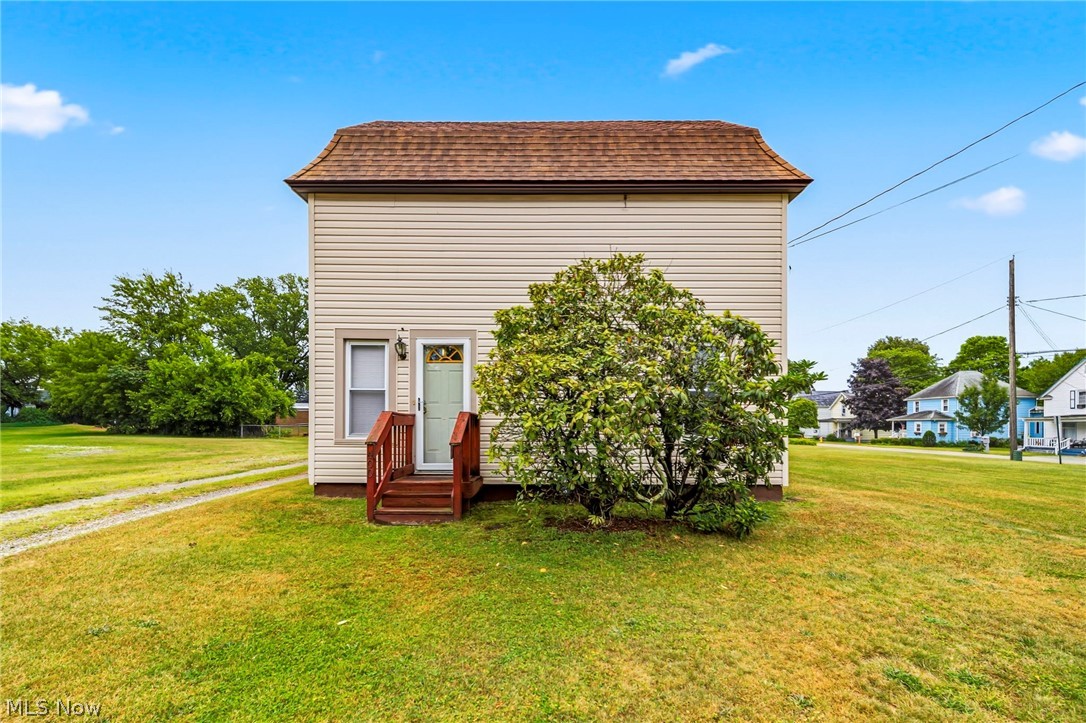 Built in 1900, this home was completely gutted and renovated in the late 1990s, pairing classic character with updated interior living. The home offers 1,156 square feet of finished living space with three bedrooms (two on the first floor!) and a full bathroom on the main floor. Upstairs you'll find a spacious loft style bedroom with ample room for storage. Outside, you'll have roughly 0.32 acres to  expand your yard, add a garage, garden, or simply enjoy added privacy and space. This home puts you close to the city's beaches, harbor, and downtown amenities making it a solid opportunity for a first-time buyer or investor looking for a move-in-ready home with built-in room to grow.