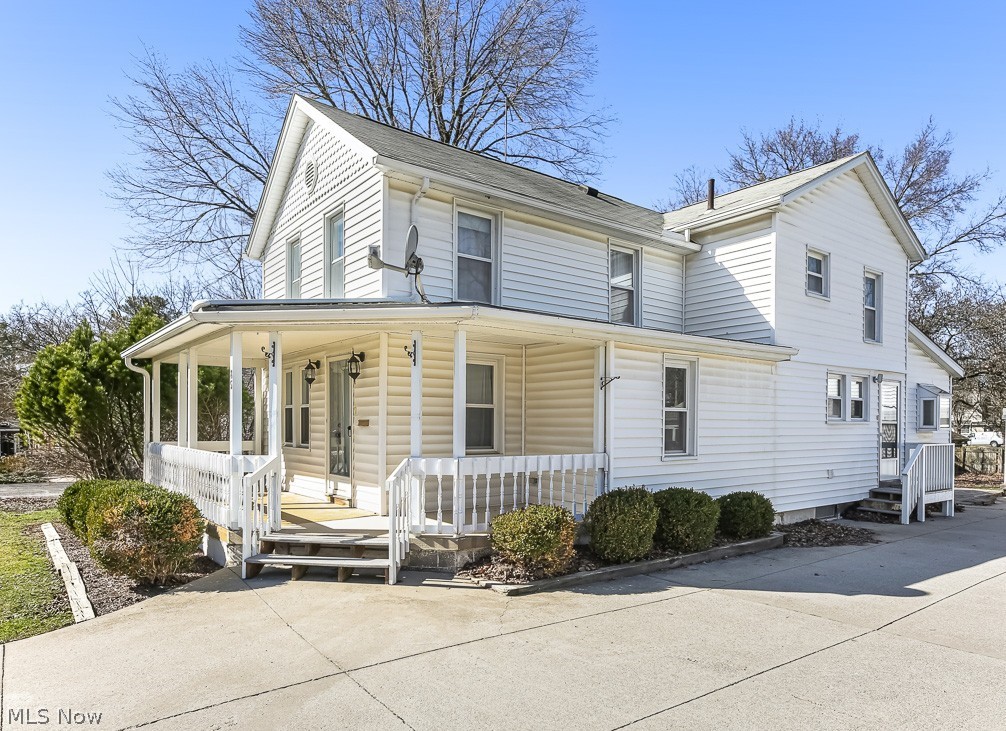 Rare Walkable Downtown Hudson Opportunity! This is not your typical century home! Just a few blocks from the heart of downtown Hudson, this beautifully updated front porch Colonial blends classic charm with modern updates and offers the rare advantage of both residential living and commercial zoning flexibility. Completely refreshed in 2024, this spacious 4-bedroom, 2-bath home with over 2,300 sq ft features bright living spaces, wood floors, and a flexible floor plan perfect for today’s lifestyle. The main level includes two first-floor bedrooms and a full bath, ideal for guests, home office space, or convenient one-floor living. The updated kitchen features excellent cabinet and counter space, granite countertops, modern backsplash, and all appliances included. A large light-filled eating area offers the perfect space for gatherings and accommodates any size dining table. Major improvements include new flooring (luxury vinyl and carpet), fresh paint, lighting fixtures, ceiling fans, landscaping, plumbing fixtures, and a newer hot water tank. A new furnace was installed in 2025 for added efficiency and peace of mind. A spacious first-floor laundry room is conveniently located just off the kitchen. The second floor offers two additional bedrooms with beautiful wood floors, a full bath, and a versatile flex room that could serve as a home office, sitting room, playroom, or additional living space. Enjoy mornings on the charming covered front porch or relax in the private backyard patio with water feature. The property also offers generous yard space and ample off-street parking, a rare find this close to downtown. Located within easy walking distance to Hudson’s restaurants, shops, parks, and community events, this property provides exceptional convenience along with strong residential, mixed-use, or investment potential. Move-in ready, updated throughout, and perfectly located — opportunities like this in Downtown Hudson are rare.