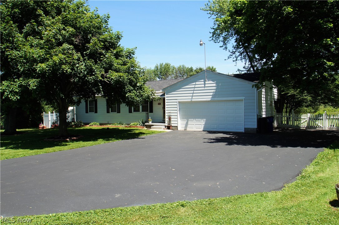 The ridiculously cute and cozy Ranch located in Hartville can make the perfect starter home or a great downsize opportunity. Clean and move in ready, with 2 bedrooms and 1.5 baths and settled on over 1.5 acres. Completely fenced in backyard, with a covered patio overlooking your own little piece of paradise. 1st floor laundry, open eat-in kitchen. Many updates include: Newer roof, furnace, basement waterproofed in 2011, 2 sump pumps, radon mitigation system installed in 2012.
There is also a generator that will transfer with the sale. Come take a look!