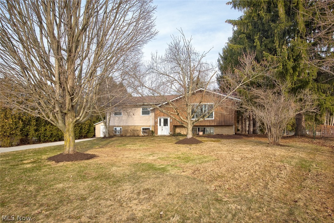 Welcome to this beautifully updated and renovated bi-level home in Green! Sitting on just over a half-acre, this property has it all. A detached 2 car garage along with a spacious backyard overlooking Mirror Lake. On the main level of the home, there is a large living room with a large window that floods this room with light. A fully stainless steel applianced kitchen, and a dining room with a french door to the back deck. 3 bedrooms including the master bedroom with an ensuite bathroom. Another full bath is off the hallway. Downstairs is perfect for entertaining! The walk-out lower level has a large family room with a fireplace, a separate dedicated area, currently set up as an office work area with a beautiful view of the lake. Another bathroom, utility room, and access to the attached 2 car garage complete this level. Some updates include; New roof 2022, new and updated windows, 1 updated furnace (2016), a new well pressure tank (2021), well pump (2021), stainless steel appliances (