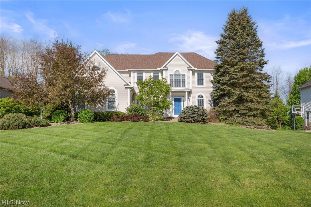 Prestige-built home blending classic American elegance with Italian-inspired design, located on over .48 of an acre on a cul-de-sac street in the sought-after Swan Lake community in Copley with a finished lower level and attached side-entry 3-car garage. Offering over 4,999 living sq ft including the finished basement, this home combines impressive scale, craftsmanship, and functionality for entertaining and everyday living. Beautiful woodwork, custom details, and warm architectural touches create a timeless feel throughout. The dramatic 2-story great room is filled with natural light from a wall of windows and anchored by a double-sided stone fireplace that flows into the eat-in kitchen and adjacent gathering spaces. Designed for hosting and daily living alike, the kitchen features black stainless steel appliances, double wall ovens, granite countertops, tile backsplash, a large center island with seating, walk-in pantry, and access to the backyard patio and outdoor entertaining area. A nearby den with a built-in bar and beverage fridge offers additional living space with potential for an in-law or guest suite setup, while the main level also includes a private office with custom built-ins and a formal dining room. The spacious primary suite includes two walk-in closets and a bath with a soaking tub, double vanity, and tiled Roman shower. Two bedrooms share a Jack-and-Jill bath, while another bedroom features a private en-suite bath. The finished lower level expands the living space with a large rec room, kitchenette, full bath, and flex room ideal for guests bedroom or a gym. Additional highlights include a main-level and backyard speaker system, sprinkler system, and invisible fence. Residents of Swan Lake enjoy access to a pool, clubhouse, and tennis courts. Recent updates include roof replacement (2020), water heater (2023), refrigerator (2022), basement finishing (2019), landscaping updates, and more.