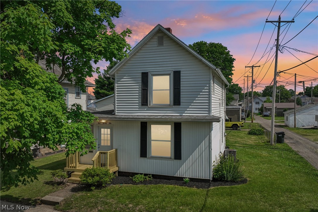 OPEN HOUSE SAT 6/27 @ 2-4PM Beautifully restored and thoughtfully reimagined, this 3-bedroom, 2.5-bath home offers the perfect blend of timeless character and modern convenience. From the inviting front porch to the refinished original hardwood floors, every detail has been carefully considered to preserve the home's warmth while embracing today's lifestyle. The heart of the home is the stunning, updated kitchen featuring crisp white cabinetry, butcher block countertops, a stylish tile backsplash, brand-new stainless steel appliances, and an open flow ideal for both everyday living and entertaining. Just beyond, the dining and living spaces showcase abundant natural light and rich hardwood floors, while the striking stone-accented electric fireplace creates a cozy focal point that instantly makes the house feel like home. The reimagined primary suite offers a private retreat complete with its own beautifully appointed ensuite bath and closet. Upstairs two additional bedrooms and an updated full bath provide comfortable accommodations for family and guests, while the convenient first-floor laundry and half bath add everyday functionality. Step outside to enjoy both the welcoming front porch and the covered rear porch, creating inviting spaces to start and end your day. Completing the property is an oversized detached garage with alley access, offering endless possibilities for storage, a workshop, hobby space, or accommodating larger recreational equipment. A clean, functional basement provides even more room for storage and organization. Extensive updates throughout the home provide peace of mind, making this property truly move-in ready. Blending classic craftsmanship with modern finishes, this is more than just a renovation--it's a home ready to be lived in, loved, and enjoyed for years to come.
