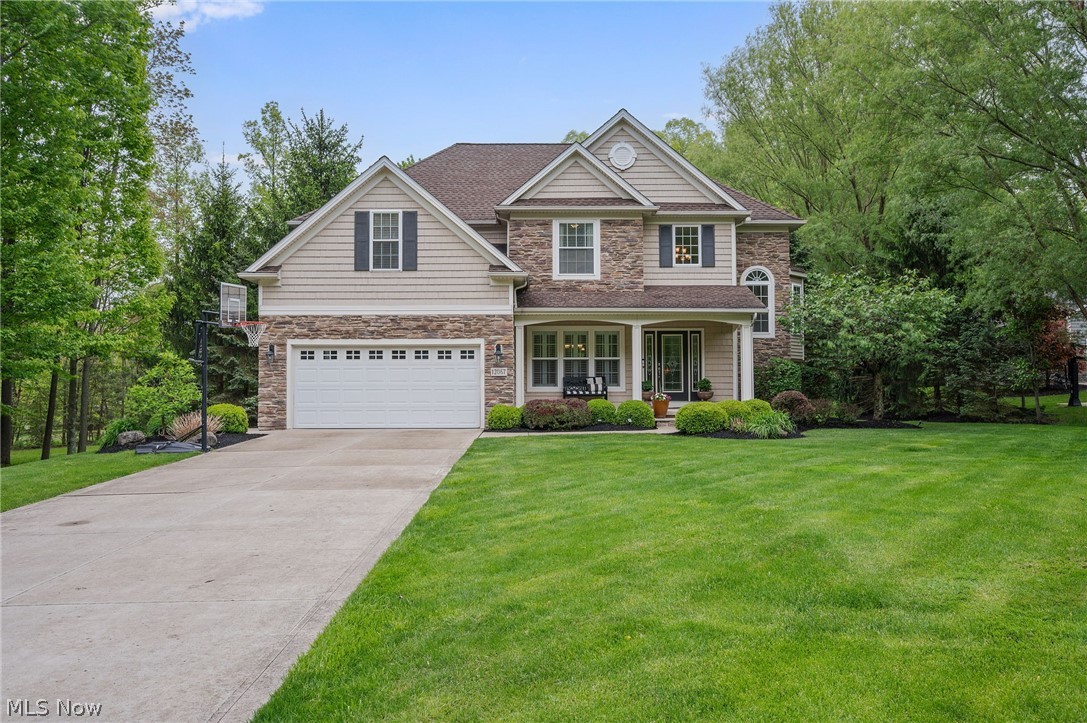 A rare opportunity to own one of the most private & spacious homesites in Concord’s Summerwood community w/no HOA fees! Beautifully maintained by its original owners, this impressive Colonial sits on over 1.13 private, wooded acres, the largest lot in the community. Located in the Riverside School District, Parkside Elementary, the home delivers a combination of privacy, outdoor living & flexibility w/ a tandem 3-car garage, finished basement & expansive paver patio w/ built-in firepit. A welcoming front porch sets the tone for the exceptional living space inside which offers 4 bedrooms, 3.5 baths & over 3,670 living sq ft, including the finished basement. The floor plan is filled w/ natural light, quality finishes & design details including a dramatic 2-story foyer w/ arched entryways, custom plantation shutters & designer RH & Uttermost light fixtures. An eat-in kitchen offers granite counters, tile backsplash, breakfast bar, stainless appliances & a dinette area w/ access to the patio. A spacious family room features a stone fireplace & large windows overlooking the patio & parklike backyard & a formal dining room is enhanced by a tray ceiling & wainscoting. A 1st-floor laundry room & mudroom add everyday practicality. A versatile 2nd-floor loft provides additional living, office, or study space. The expansive primary suite includes a tray ceiling, sitting area, walk-in closet & private bath w/double vanity,soaking tub & separate walk-in shower. The finished lower level expands the home's possibilities w/a large recreation room featuring a built-in entertainment center, bonus room that could be used as a 5th bedroom & full bath, ideal for guests,multi-generational living, home office, fitness space, or additional gathering areas. RECENT UPDATES include: Replaced AC capacitor, hot water tank, fridge & dryer (2025), washer (2024), dishwasher (2021), stove (2018),painted throughout (2026) & more! INCLUDED are ALL kitchen appliances, washer/dryer & window treatments.