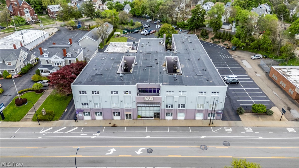Occupying a prominent position in Akron’s thriving East Market Corridor, "The 797 Building" represents a rare opportunity to acquire a diversified, 66,000+ SF mixed-use asset with immediate equity potential. This three-story property is anchored by the prestigious Alexander Pierce Restaurant, providing a stable commercial foundation with a current lease of $9,000 per month. The building’s revenue is further bolstered by 40 luxury one- and two-bedroom apartment residences, which command monthly rents between $1,000 and $1,400. Extensive renovations completed between 2019 and 2020 modernized the infrastructure, including residential unit updates, the installation of energy-efficient mini-split heating and cooling, and significant upgrades to all common areas. Beyond standard residential living, the property offers an upscale hospitality experience through its members-only Coat Room Lounge and the innovative first-floor Screen Suites, which provide private dining and theater experiences. Residents enjoy a robust amenity package featuring a business center, exercise room, multiple club lounges with workspaces, a pool table, and private event spaces. Practical needs are met with onsite laundry services, full security and fire systems, multiple elevators, and off-street parking for 84 vehicles. Ideally located near the University of Akron, major medical hubs, and downtown Akron, this extensively renovated asset is perfectly positioned to capitalize on the region’s emerging growth.