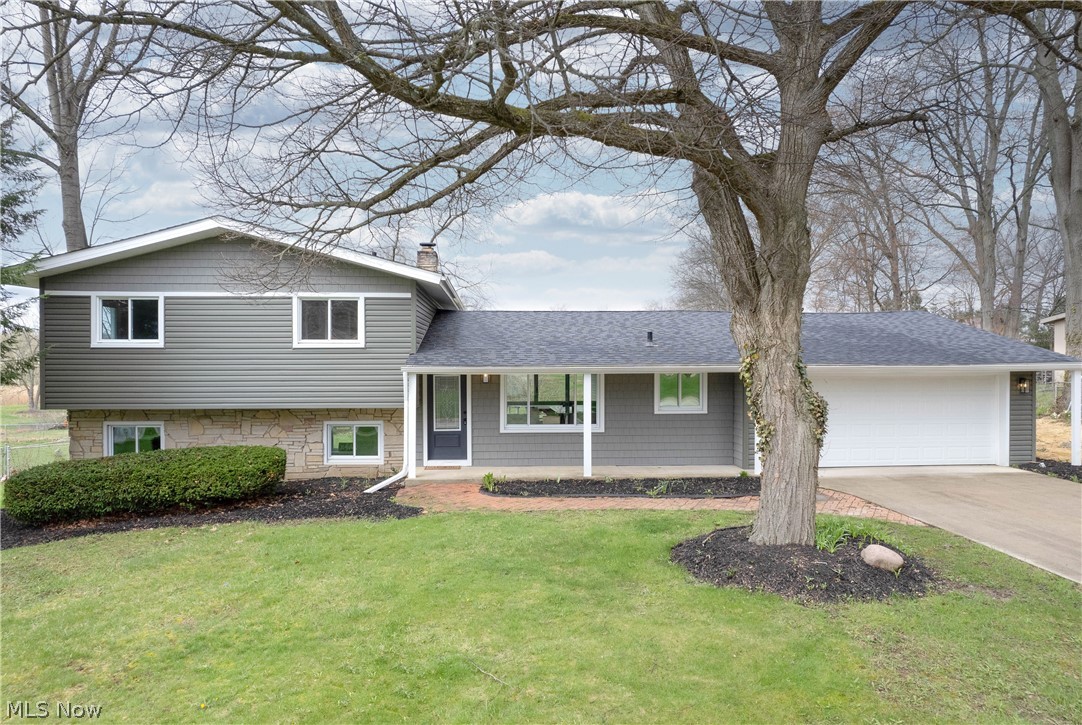Modern Luxury Meets Nature: Renovated 3,600 Sq Ft Retreat. Discover the blend of modern sophistication and natural beauty in this renovated 5-bedroom, 5-bathroom (3 full, 2 half) split-level home. Backing onto Fairlawn Preserve and Nature Walk, this property is an opportunity to own a virtually new home in a prime Fairlawn location. Designed for entertaining and relaxation, the home features a brand-new gourmet kitchen with a quartz island, new cabinets, high-end stainless steel appliances, and a 6-burner cooktop. The open floor plan flows over refinished hardwoods and waterproof LVL flooring. The first-floor primary suite is a sanctuary, with an enormous walk-in closet, a private 2nd laundry room, a soaking tub, a double vanity, and a custom glass shower. A new family room, new 1/2 bath, and two fireplaces add warmth, while the filled-in pool area has been transformed into functional space, fully permitted and ready for the new owner. The renovation spared no detail: Exterior: New roof, siding, gutters, soffits, a 2-car attached garage with extra-large driveway, and a spacious rear deck overlooking the preserve. Mechanicals: Two new high-efficiency HVAC units, a Navien tankless water heater, all-new plumbing, electrical, LED lighting, and gas lines. Insulation up to R42 in new sections for energy efficiency. The original wing includes an additional master suite, 2 full baths, and 3 more bedrooms. The lower level has a 2nd laundry room, family room with walk-out to the fenced backyard, and an additional 1/2 bath. Neighborhood & Lifestyle: Step out your back door into the 66-acre Rosemont Preserve, with boardwalks and trails (coming in 2026). Located in the top-rated Copley-Fairlawn School District, you're minutes from Montrose's premium shopping and dining while enjoying a quiet, park-side lifestyle. If you're searching for the perfect home, look no further! Contact our office today to schedule a private showing or to submit your offer!