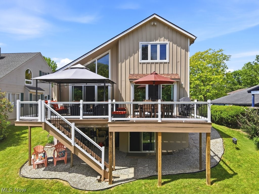 Lake Life Starts Here at Atwood Lake! Get ready to enjoy everything lake living has to offer in this beautifully updated 3-bedroom, 3-full-bath home with convenient inlet access and two docks that transfer with the property! Private land saves big money with no annual lease fees. Launch your kayak or paddleboard right from your backyard and paddle your way to the main lake, or take a short stroll to your private docks and spend the day on the water. Inside, you'll love the soaring cathedral ceilings and abundance of natural light that create an open, airy feel throughout. The spacious kitchen is designed for entertaining, featuring granite countertops, a gas stove, beverage refrigerator, and easy access to the expanded deck—perfect for relaxing mornings, outdoor dining, and summer gatherings. The inviting living room offers a cozy gas fireplace and durable laminate flooring, while the main-level bedroom and full bath provide convenient first-floor living. Upstairs you'll find two oversized bedrooms with plenty of space for guests, family, or extra sleeping accommodations after a fun day on the lake. The walkout lower level features high ceilings, a full bath with walk-in shower, wet bar, refrigerator, and ample storage space. Finish it to create additional living or recreation space and truly make it your own! Recent improvements provide peace of mind, including a brand-new roof (June 2026), central air (2024), and a complete remodel completed in 2015/2016. Quality features include solid wood doors throughout and a WiFi thermostat.  As an added bonus, owners enjoy access to the private Paradise Point Beach, making it easy to enjoy swimming, sunbathing, and lakeside fun. Whether you're looking for a full-time residence or weekend retreat, this property offers the perfect blend of comfort, convenience, and Atwood Lake adventure! Don't miss your chance to make every day feel like a vacation.