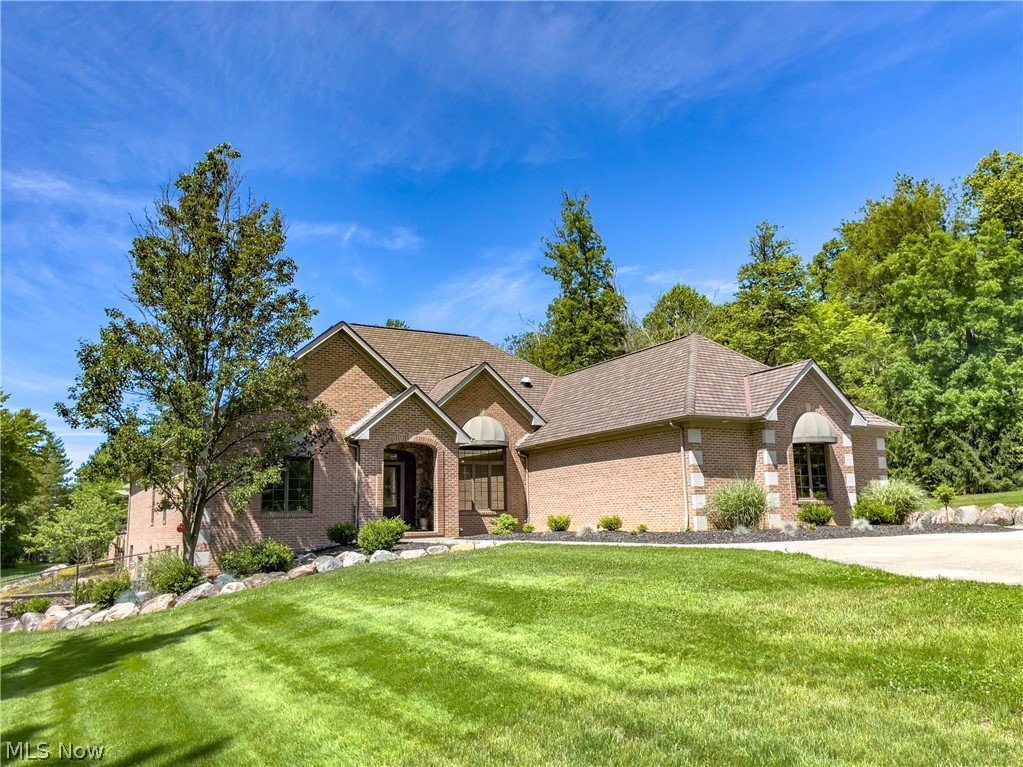 Rare and Unique All Brick 4 Bedroom, 3.5 Bath Ranch. Set back on one of the most private settings in Broadview Heights. This home has nearly 7 acres and will allow up to 6 horses. It has a newly remodeled Kitchen that has a large island along with an Open Concept Floor Plan. There are Vaulted Ceilings and Gorgeous Finishing's throughout this home. There is a  Full, Finished, Walk-Out Basement leading to decorative stamped concrete patio. Both patios offer secluded and scenic outdoor living space that is complemented by exquisite hardscape. The 2nd laundry room is located on the  lower level. 3 car attached garage. There is plenty of room for any toys in the Large, Heated and Insulated outbuilding. It has 10ft double doors. The outbuilding has a covered porch and also has a bathroom. Horse riding trails are directly across the street. This home is absolutely stunning!  A Must see to appreciate!  Experience scenic country living with all of the amenities of easy city life!
