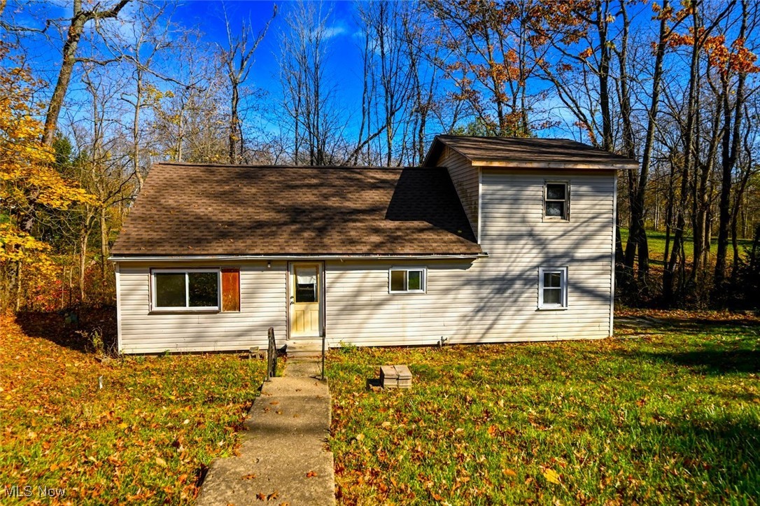 **GREAT OPPORTUNITY To Own This Home @ A Great Price! Handyman, Investor OR Live Here & Remodel As You Go! *Over 1,200 Square Feet Includes 3-4 Bedrooms, 1 Full Bathroom &  Basement For Storage *HUGE DETACHED 720 Sq. Ft. Concrete GARAGE Is A Mechanics Dream! Great For Vehicles, Woodworking Shop, Man Cave & More! NEW GARAGE ROOF Within 3 YRS!! *Front Concrete Basketball Pad W/Hoop *Additional Sturdy Storage Shed *Long Driveway ~ Home Sits Far Back From The Road For Privacy And Is OVER 1/2 AN ACRE OF LAND! *Small Creek Runs Behind The Home/Sit Outside & Enjoy The Sounds Of Nature! *Updated VINYL WINDOWS, Updated Electric *Walk In & To The West Is A First Floor Living Room Converted Into A 1st Floor Bedroom If Needed! Would Also Make A Great Formal Dining Rm *The Kitchen Has Some Newer Cabinets Already + Semi Faux Marble Laminate Countertop. Note: In The Family Room Is Another NEW Kitchen Cabinet W/Pullout Drawers You Can Move To The Kitchen. Stainless Steel Faucet & Sink. Some Newer Flooring Started *Family Room Addition W/Grey Luxury Vinyl Plank Flooring, Triple Ceiling Lights Including A Fan & Slider To The Side Yard! *FIRST FLOOR LAUNDRY W/Updated Plumbing Near The Full Bathroom *Upstairs Are 2-3 Bedrooms. One W/A Newer Framed Closet, Bedroom Between (no closet) & Master Bdrm That Is A Great Size!! *Lawrence Township - Great Location - Northwest LSD, Stark County *Beautiful Scenic Setting, Massive Garage Could Fit A Boat -- This Is OPPORTUNITY KNOCKING, To Put Some Sweat Equity Into It & Make A Great Return, Rent Or Resell Or Enjoy The Benefits Of Living Here *As Is