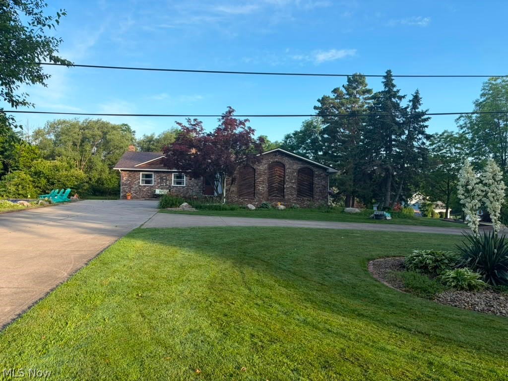 7734 Morley Road isn't a house you settle into. It's a house you grow into, live loudly in, and never want to leave. It's where the kids claim the basement and never come up. Where summer doesn't end because the backyard won't let it. Where guests stop being guests because the in-law suite just makes sense. Where date night is staying in because the theater room is right there. Where you wake up, open the bedroom doors, and the pond is just sitting there catching the sunrise and reminding you that you made a really good decision. It's where holidays actually happen at your house because there's room for everyone and then some. 

Where the grandparents have their own space and their own front door. Where the kids disappear into the ninja course and come back exhausted. Where a Tuesday night swim feels like a luxury and watching the sunset from the deck feels like something you'd pay for somewhere else. This is a home that grows with you through phases of life, through seasons, through the moments that end up mattering most. Nature right outside the door, modern living on the inside, and somehow the best of both without giving anything up. It has more to give than most families will ever fully use, and that's exactly the point. 

Four bedrooms, a dedicated office, a spa-style primary suite with a walk-in closet and a bathroom that genuinely earns that description. A private pond with a wooden footbridge leading to a sprawling open yard and a playground and space that will grow and adapt to them. An above-ground pool with a custom deck. A home theater. 

A fully independent in-law unit. A basement climbing gym. Nearly an acre in Concord Township. Nothing in this market compares. 

Brand new roof and gutters!
