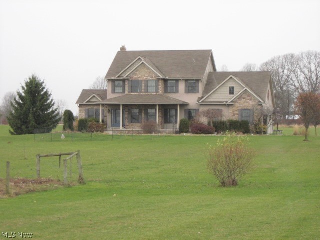You will love the privacy of this custom built home, sitting on a beautiful 7 acre lot.  This warm, friendly home invites your entry from the covered front porch onto the beautiful wood floored foyer.  Off the foyer find the office featuring beautiful French door and skylights - which was used as a first floor guest bedroom.  There was a shower added to the first floor bath to accommodate 1st floor living.  The spacious kitchen features ample cabinets and counter space and island breakfast bar.  The large open family room features wood burning fireplace.  Master bedroom has 2 closets and luxury bath. Basement is large and is plumbed for extra bath and has access steps leading to garage. Heating system is zoned heat for main and second floor. New deck was just installed in 2022. 13 course basement. Enjoy the peace that country brings in this tranquil setting.