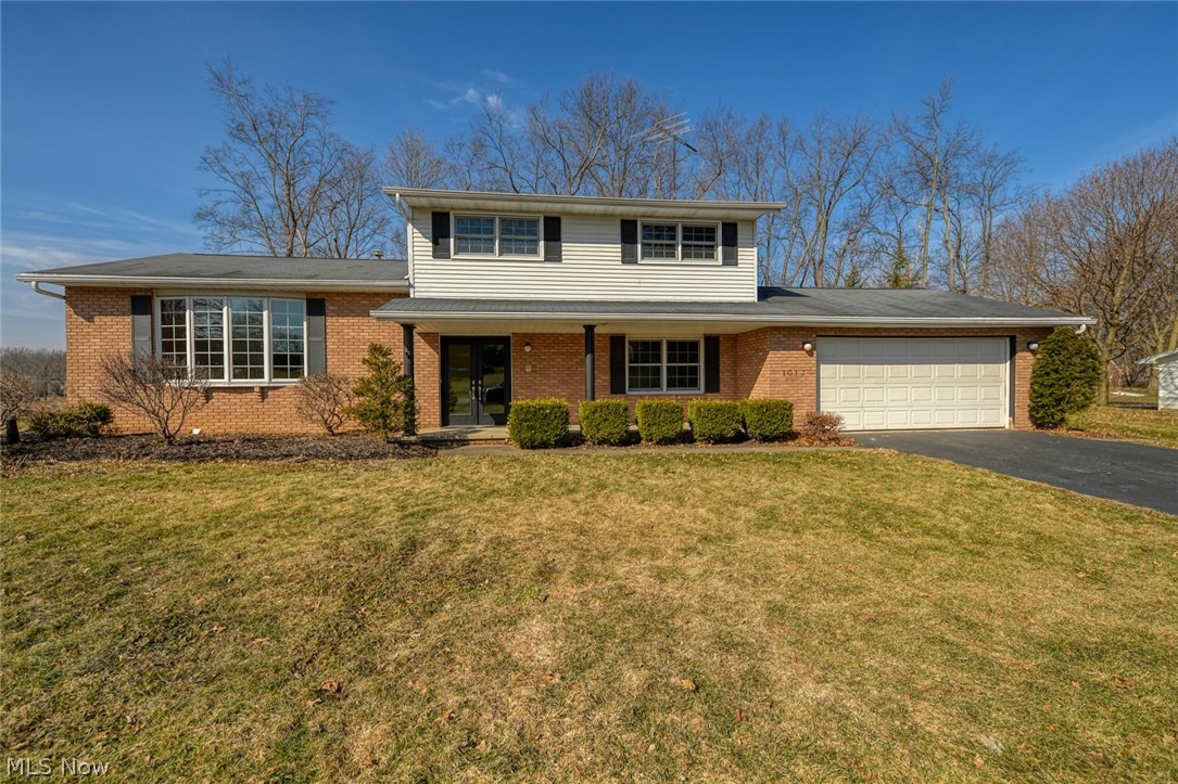 This Hartville home has it all, 3 or 4 bedrooms (utilizing the bonus room), living room and family room and 3 car garage or 2 car plus an amazing workshop!  Enter in through the new energy efficient Provia double doors, into the large foyer.  You will immediately notice the gorgeous bamboo floors in the living room.  This room is wide open and soaks up all of the natural sunlight through the, nearly floor to ceiling bay window.  Continue into the formal dining room, which also features the bamboo flooring and new lighting.  The kitchen also basks in the bright sunlight from another bay window with seating/display area.  No broken dishes with the shock absorbent cork floors!  This kitchen provides tons of cabinet space, including a lazy susan, tile backsplash, all appliances included and open to the family room.  The woodburning, brick fireplace and access to the sunroom, makes the family room the place to be.  The sunroom features a set of sliders from the family room, plus 3 more to k