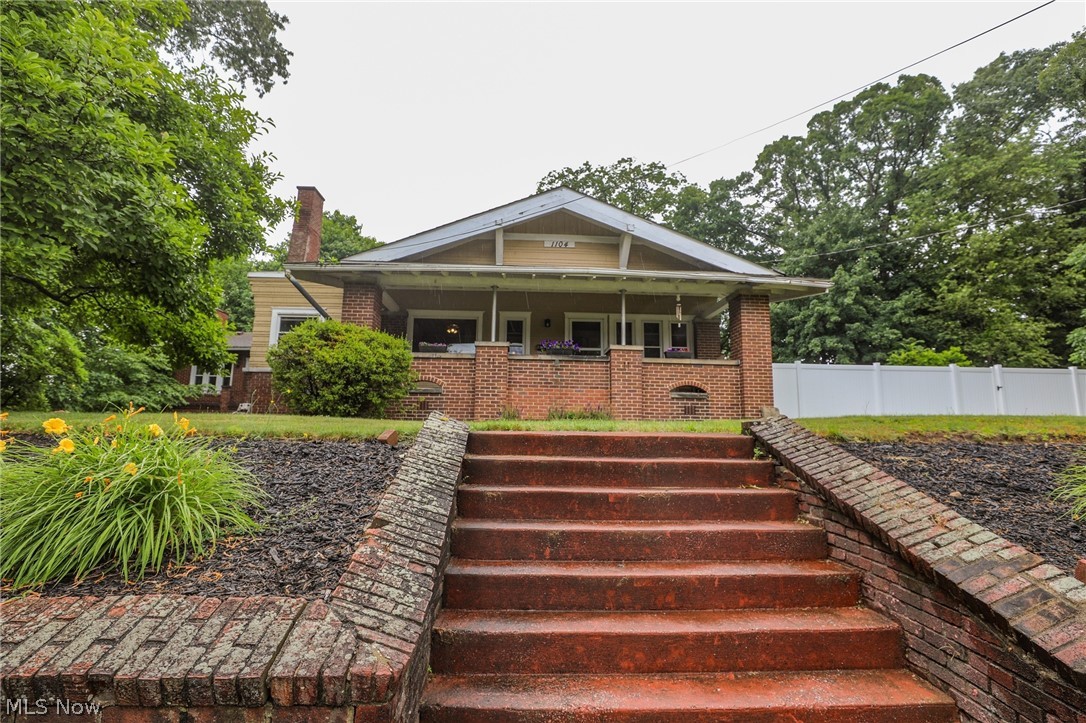 Introducing 1104 N. Howard St., a majestic century home located in the heart of Akron, Ohio. This impressive property boasts 5 spacious bedrooms and 2 full bathrooms, spanning 3,316 square feet of luxurious living space. The grand living area features stunning ceilings, exquisite woodwork, and a cozy fireplace. As you explore the main floor, you'll discover a formal dining room with a large table included in the sale, an additional dining area for everyday meals, a spacious family room with a fireplace, a private office area with room for two desks, and a beautifully updated kitchen equipped with ample space and modern appliances. The main floor is perfect for entertaining, with plenty of room for guests, holiday parties, and more. The primary bedroom is a serene retreat with original hardwood floors, accompanied by an additional bedroom and full bathroom on the main level. The second level features three generously sized bedrooms with original hardwood flooring and spacious closets, as well as a full bathroom. The expansive basement offers a workshop area, a small garage, and laundry hookups, complete with a washer and dryer. The exterior of the home showcases vintage brick and wood shaker siding, recently painted, and boasts a breathtaking view from the enormous deck overlooking a ravine, as well as a charming side yard perfect for children or pets. This unique century home is a rare find - schedule your private showing today to make it yours.