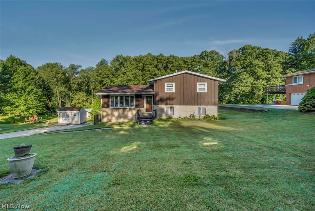 Welcome home to 1347 S Polen Ave., a perfect 4 level split home located on a dead end street in Suffield! When you pull in, you will love the long concrete driveway the leads you to your attached garage and work shed; perfect spot for a man cave or tool storage! Step inside and feel instantly at home with the vaulted ceilings and natural light pouring into the living room. The kitchen and dining space open into a large 3 seasons room overlooking your private, park-like back yard (and an additional shed for yard equipment)! Upstairs has 3 bedrooms and a full bath. The lover family room has a wood burning fireplace and walk out onto a patio overlooking the property. A huge laundry room/utility room with a shower complete this level. The basement offers storage space and garage access. New siding and new windows in 2018. This home is close proximity to the schools, highway access, shopping and more! Call today to schedule your private showing!