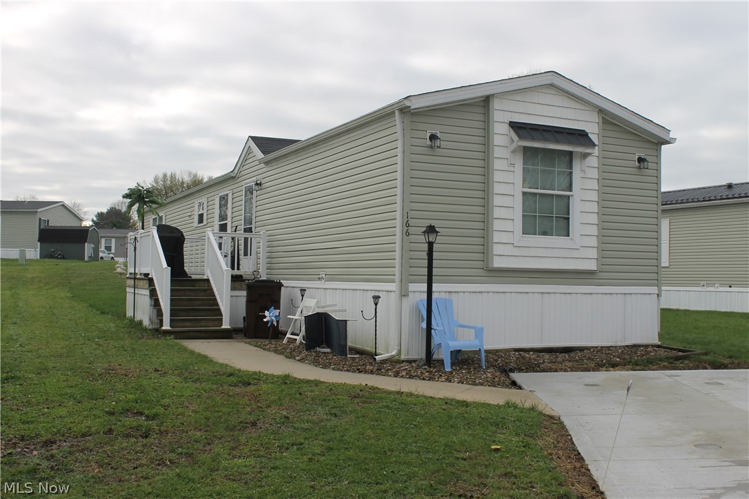 Welcome to this well-maintained 3-bedroom, 2-bath mobile home located in the desirable Melrose Village community! Offering over 1,100 sq. ft. of comfortable living space, this home features a functional and inviting layout perfect for everyday living and entertaining. A welcoming deck greets you as you enter into the spacious living room, which flows seamlessly into the eat-in kitchen—ideal for gatherings and creating an open, connected feel. The kitchen is highlighted by warm oak cabinetry, ample counter space, and sleek black appliances that add a modern touch. Down the hall, you’ll find the owner’s suite complete with a full private bath and generous closet space. Two additional nicely sized bedrooms, a second full bath, and a convenient laundry area complete the interior. Outside, enjoy the convenience of a concrete parking pad with space for two vehicles, along with a storage shed to meet your extra storage needs. Melrose Village offers fantastic community amenities including scenic fishing ponds, playgrounds, and a community center available for private events and gatherings. Conveniently located, this home is a great opportunity for buyers seeking comfort, value, and a welcoming community to call home.