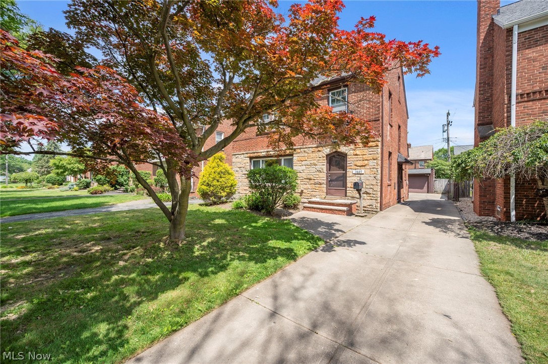 Wow! This stunning brick Colonial is full of character and charm, featuring beautiful architectural details throughout. Light-filled living room offers abundant natural light and a decorative fireplace, Formal Dining Room, family room featuring built-in bookshelves and overlooks the backyard, making it the perfect spot to relax or entertain, updated kitchen with a breakfast nook and built-in shelving, and a convenient half bath. Upstairs you'll find 3 large bedrooms and a full bath with both a tub and separate shower. The 3rd floor offers an additional 4th bedroom, Large Rec room in the basement offers another decorative fireplace. Hardwood floors throughout. Fenced backyard, patio, 2-car garage, and central A/C. Conveniently located near schools, shopping, parks, Downtown Cleveland, and major hospitals. Schedule your showing today!