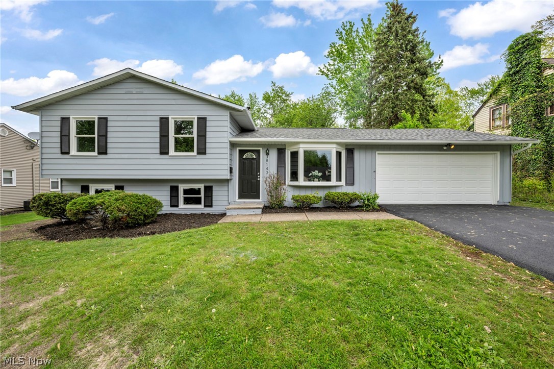 Welcome to this beautifully remodeled four bedroom, one and a half bath split level home that offers all of the amenities your looking for in a place to call home. What a stunning transformation has taken place with todays modern design, makes it feel so cozy. The brand new kitchen offers soft close shaker style cabinets, granite counter tops with ample counter space, stainless steel appliance package, a tile back splash and a ceramic floor. A separate dinning space creates a relaxing environment to enjoy those family meals. The freshly painted interior and exterior keeps things bright and fresh. The spacious living room with a bow window and luxury vinyl plank flooring flows into the lower level family room with new carpeting, a wood burning fire place, a bedroom or office space to suite your family's needs. And a conveniently located half bath off the laundry room. The walk out lower level provides easy access to the fenced in back yard and re built retaining wall. The upper level provides three spacious bedrooms and one full bath, the spacious primary suite with new carpeting, his and hers closets and abundance of natural light with access to the main bathroom. The main bathroom provides a double sink, a jetted tub, new vanity, granite counter top, ceramic floor and new light fixture. So many improvements have been completed such as a NEW roof, furnace, A/C, concrete patio, asphalt driveway, exterior doors, kitchen, baths, light fixtures and much more. A two car attached garage with access to the new 21 x 11 concrete patio and fenced in back yard. Located just minutes away to highway access, local restaurants, shopping and all amenities Mentor has to offer.