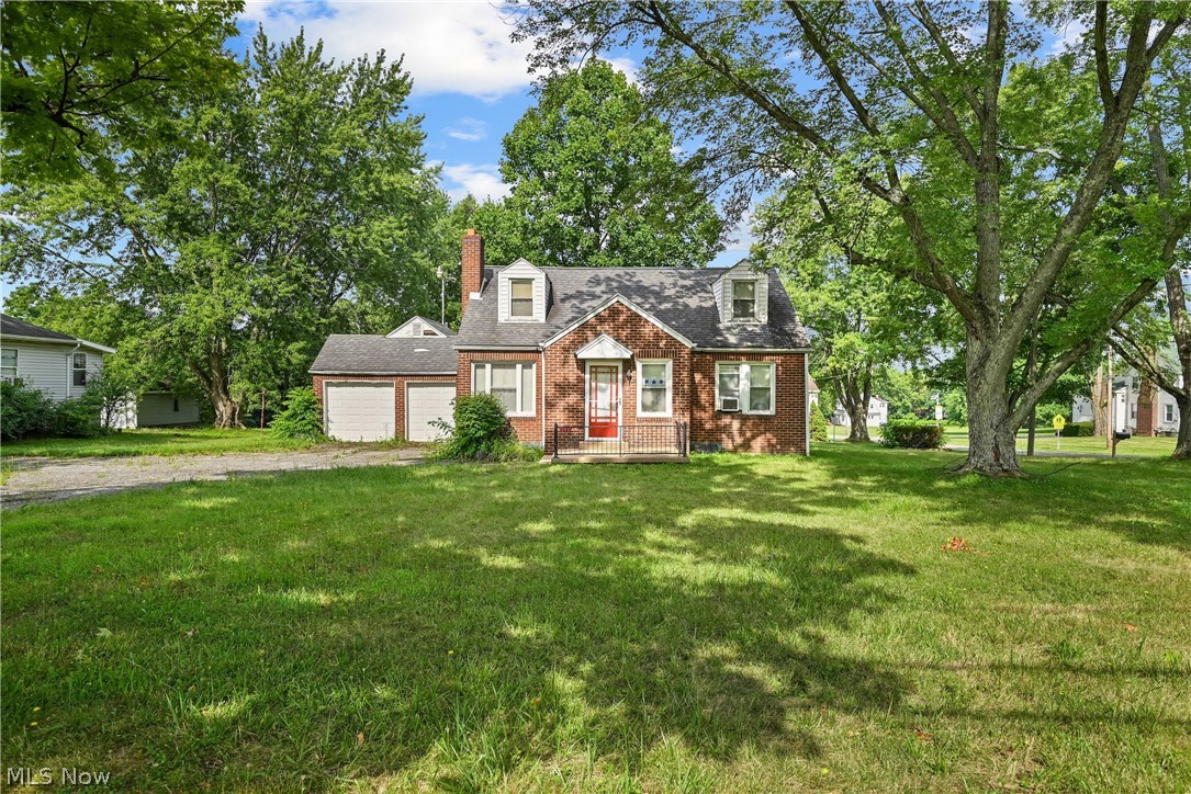 Two homes on one parcel zoned commercial.  One home is all brick with beautiful natural wood floors. The brick fireplace in the living room is just waiting for its new owners to love it! Homes are solid for your personal home or as an investment. 1,584-square-foot Brick Cape Cod full of character and potential, while the second is a 704-square-foot sided Ranch, ideal for personal home, business, office space, rental income, or expansion opportunities.