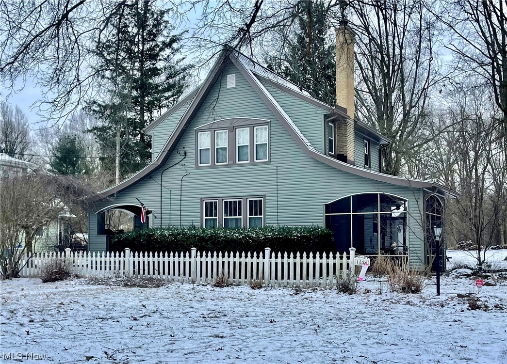 This is the one you’ve been waiting for! Welcome to 1826 Arndale Rd in the heart of Stow. This home greets you with an exquisite exterior- with not one, but two porches (one open and one screened). Nestled on picturesque yard with over a 1/2 acre, this is truly a rare opportunity to own a one-of-a-kind home. Inside is equally lovely, with loads of charm and stunning hardwood floors throughout.  The kitchen is spacious and features ceramic tile, ample cabinet space, a swing out pantry, as well a French door stainless steel refrigerator and double sink. The living room and dining room are open and inviting, perfect for enjoying spending time with family and friends. The living room also boasts a cozy wood burning fireplace with white brick surround, arched entryways, and an opening to the staircase which adds to the character. The windows on the main level are East and West facing, which allows sunlight into the dining room in the morning for breakfast, and time to enjoy the sun again on the patio in the evenings as the sun sets in the West. On the second level you will find three nicely sized bedrooms, a full bath with a white subway tiled shower and beadboard wainscoting. The full basement provides ample storage space, and an additional bathroom w/ a standing shower. Updates include new siding (2023), new HWT (2023), new garage roof (2022), new resin in water softener (2022), & more. There is a 2-car detached garage, large driveway, a trellis, and tons of space for the family and pets to enjoy. A home warranty is included for peace of mind. Don't miss your chance to call this incredible house your home! Schedule your private showing today!!
